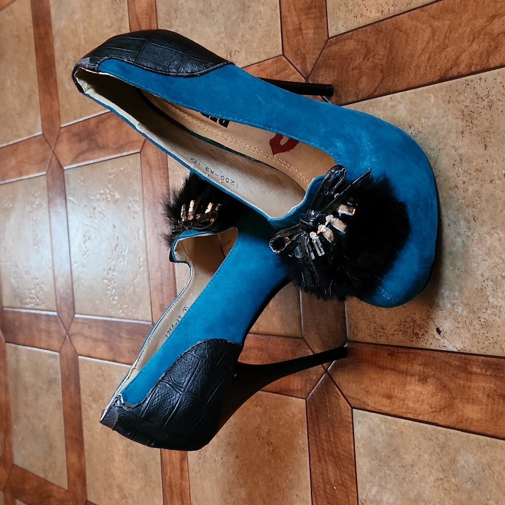Teal and black platform pumps